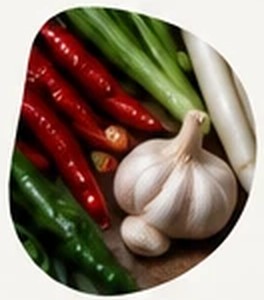Red chilies, green onions and a bulb of garlic