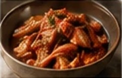 A bowl of glossy red braised banchan
